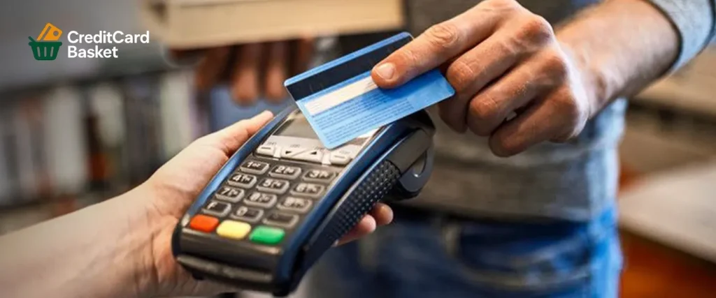 A man preparing to pay at a card machine, practicing responsible habits to manage his credit utilization ratio for a better credit score in 2026.